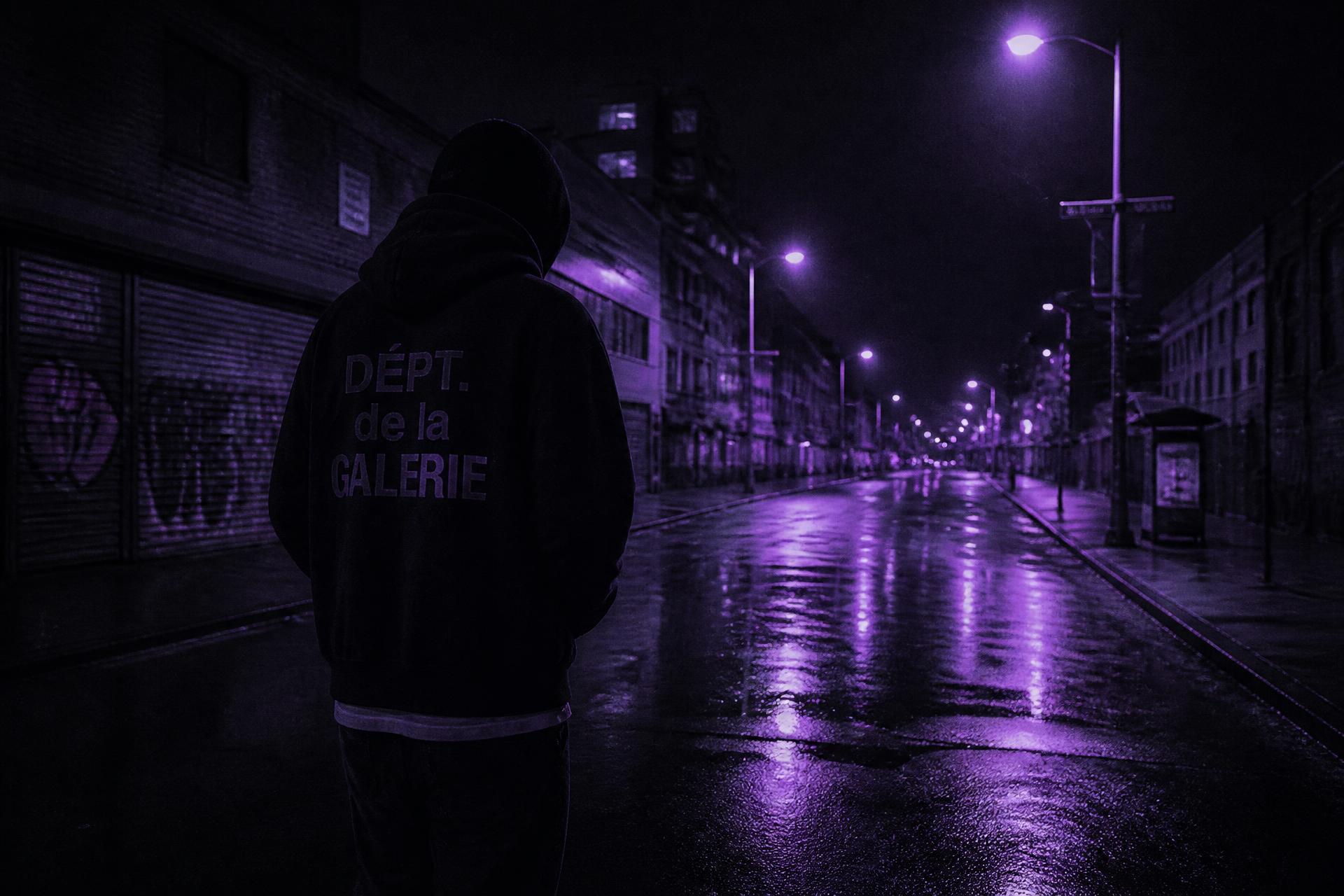 Empty street at night soaked in purple light